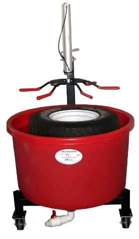 Movit Tire's 39ED tire dunker, a red plastic basin on casters with a powered mechanical arm to submerge car tires placed inside it